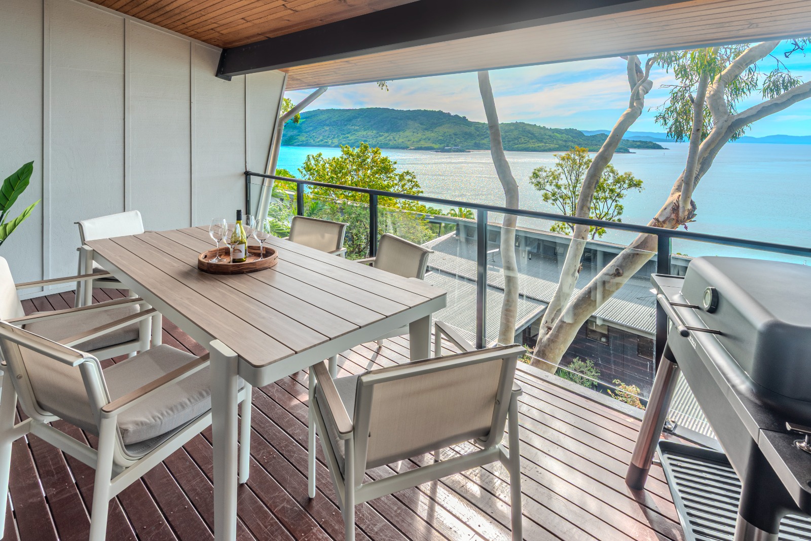 Large covered balcony with BBQ and turquoise water views from Shorelines 10.
