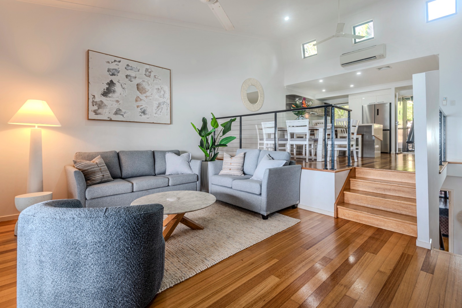 Split-level living and dining area inside Shorelines 10 Hamilton Island.